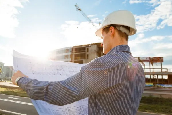 Architect holding construction plans.